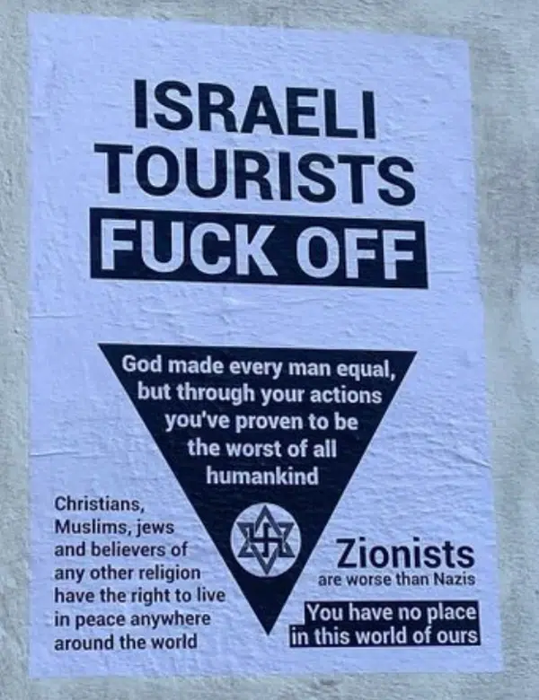 Antisemitic poster in Coimbra telling Israeli tourists to "fuck off," declaring Zionists worse than Nazis, and stating they have no place in the world.