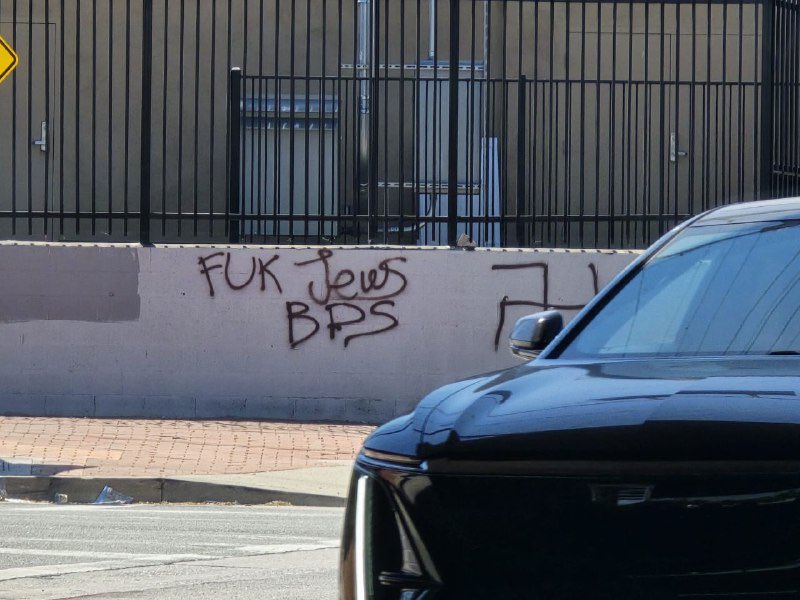 Antisemitic graffiti reading “F--- Jews BDS” spray-painted on a wall in Los Angeles, alongside a swastika, outside the Israeli-American Council headquarters.