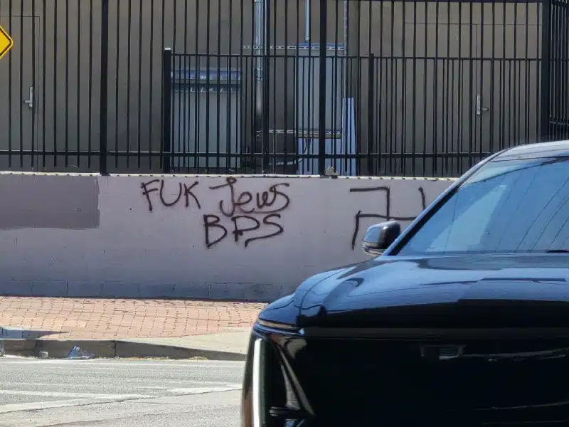 Antisemitic graffiti reading “F--- Jews BDS” spray-painted on a wall in Los Angeles, alongside a swastika, outside the Israeli-American Council headquarters.