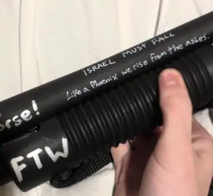 A firearm linked to the Minneapolis school shooter with the phrase “Israel must fall” written on it in white marker.