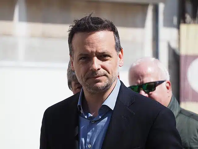 Haris Doukas, Mayor of Athens, pictured outdoors, facing the camera.