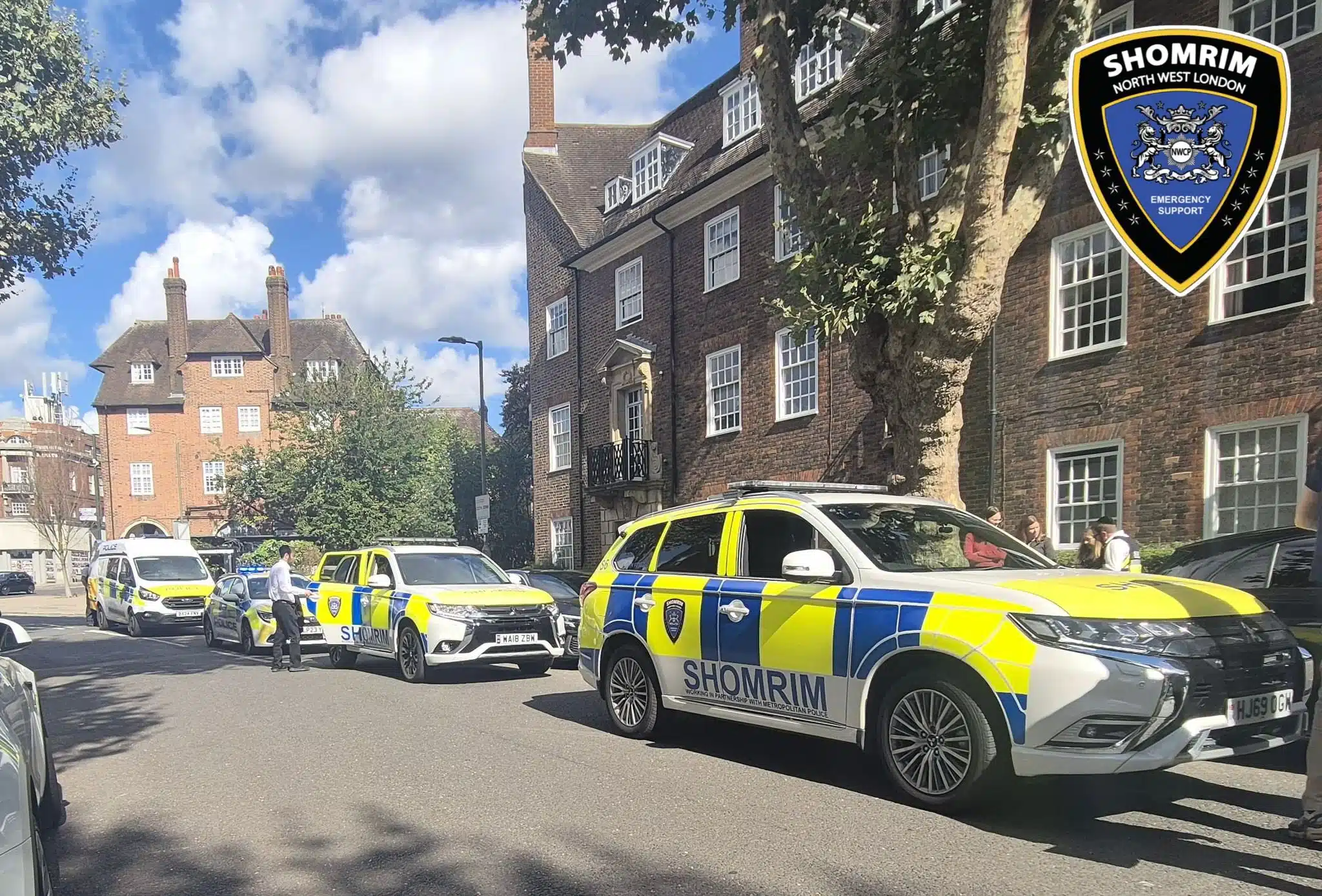 Police and Shomrim emergency vehicles lined up on a residential street in Golders Green, north London, during increased security patrols after antisemitic attacks on Jewish sites.