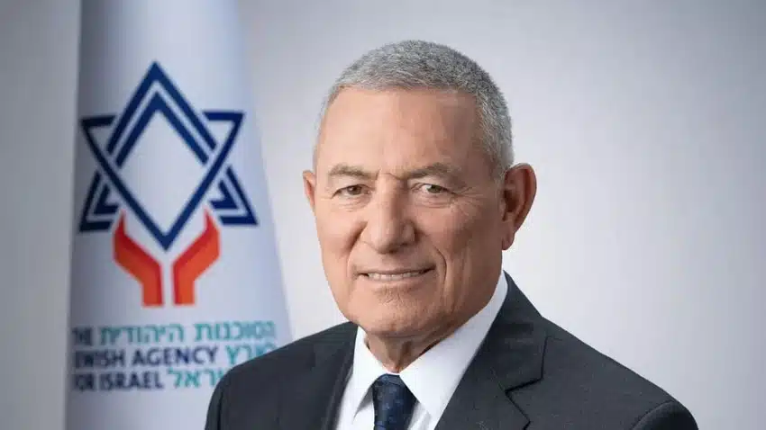 Doron Almog, Chairman of the Jewish Agency for Israel, pictured in front of the organization’s logo.