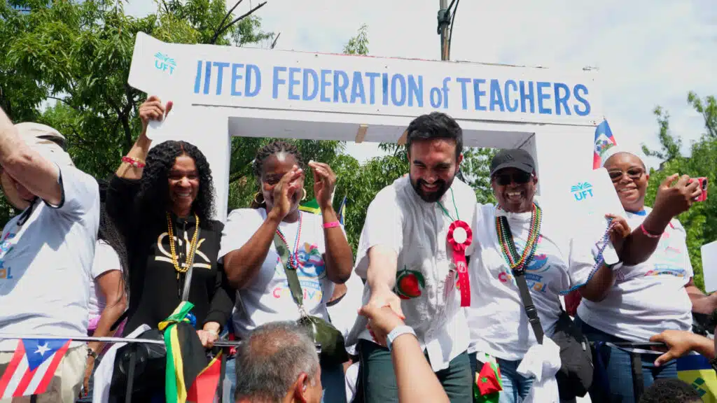 Democratic mayoral candidate Zohran Mamdani stands with United Federation of Teachers members at a public event in New York City