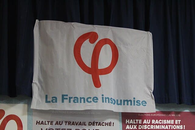 Banner of the French left-wing party La France Insoumise displayed at a public event in France.