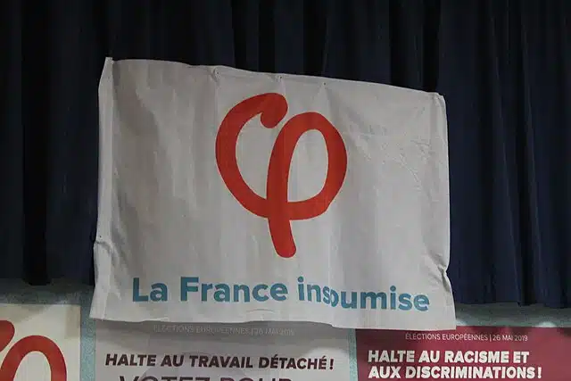 Banner of the French left-wing party La France Insoumise displayed at a public event in France.
