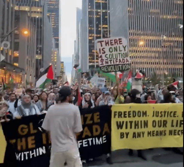 Protesters in New York City hold Palestinian flags and banners reading “Globalize the Intifada” and “There Is Only One Solution: Intifada Revolution” during an anti-Israel rally on the second anniversary of Hamas’s October 7 massacre.