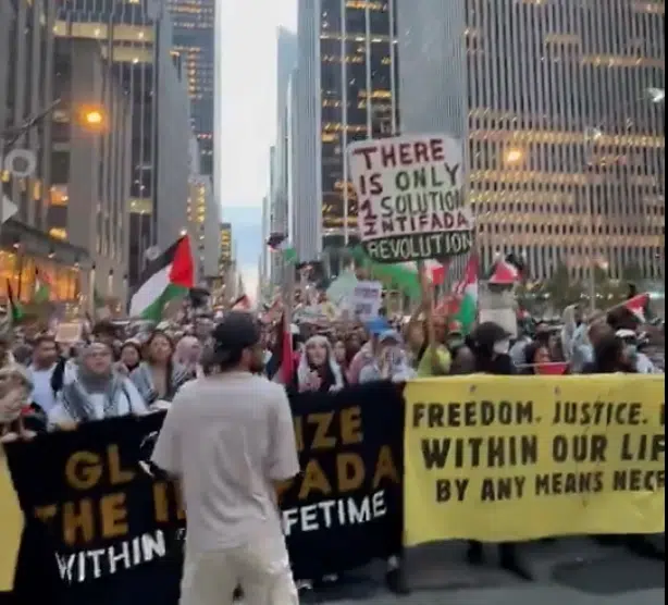 Protesters in New York City hold Palestinian flags and banners reading “Globalize the Intifada” and “There Is Only One Solution: Intifada Revolution” during an anti-Israel rally on the second anniversary of Hamas’s October 7 massacre.