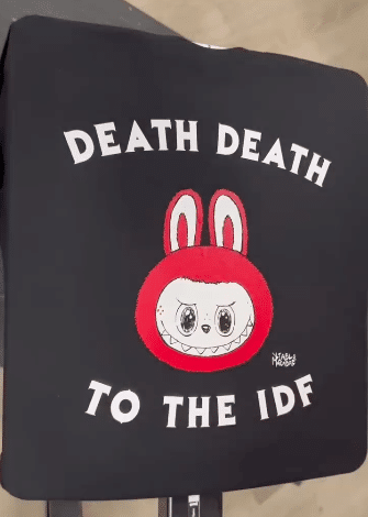 Black T-shirt featuring cartoon character and slogan “Death Death to the IDF,” promoted by Punk With a Camera on a Shopify-hosted store.