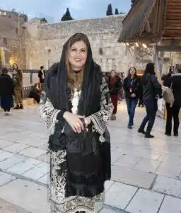 Anila Ali stands at the Western Wall in Jerusalem during a visit to Israel.