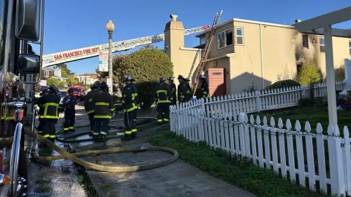 San Francisco firefighters respond outside a building damaged by an arson fire at San Francisco Hillel on December 5.