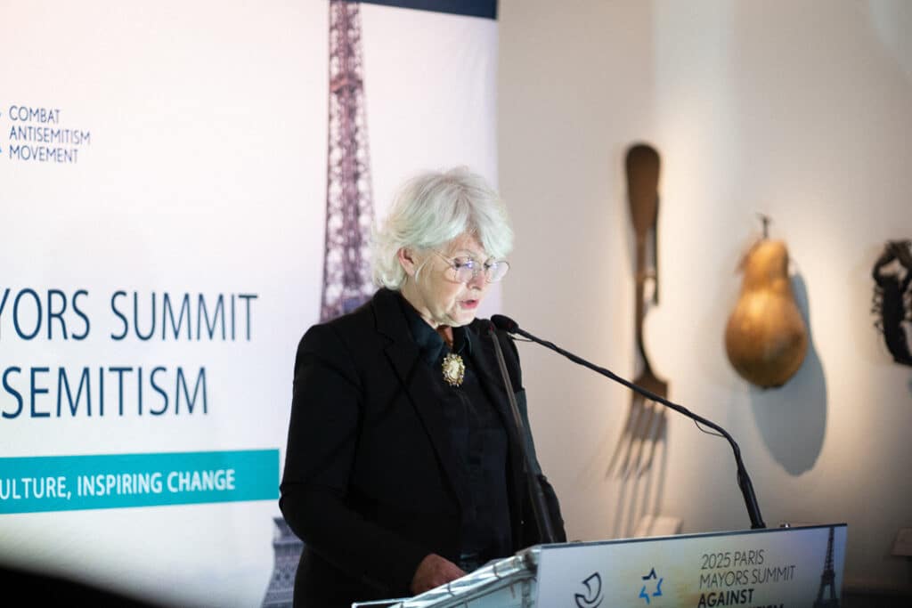 Ambassador Isabelle Rome addresses attendees at CAM's 2025 Paris Mayors Summit Against Antisemitism