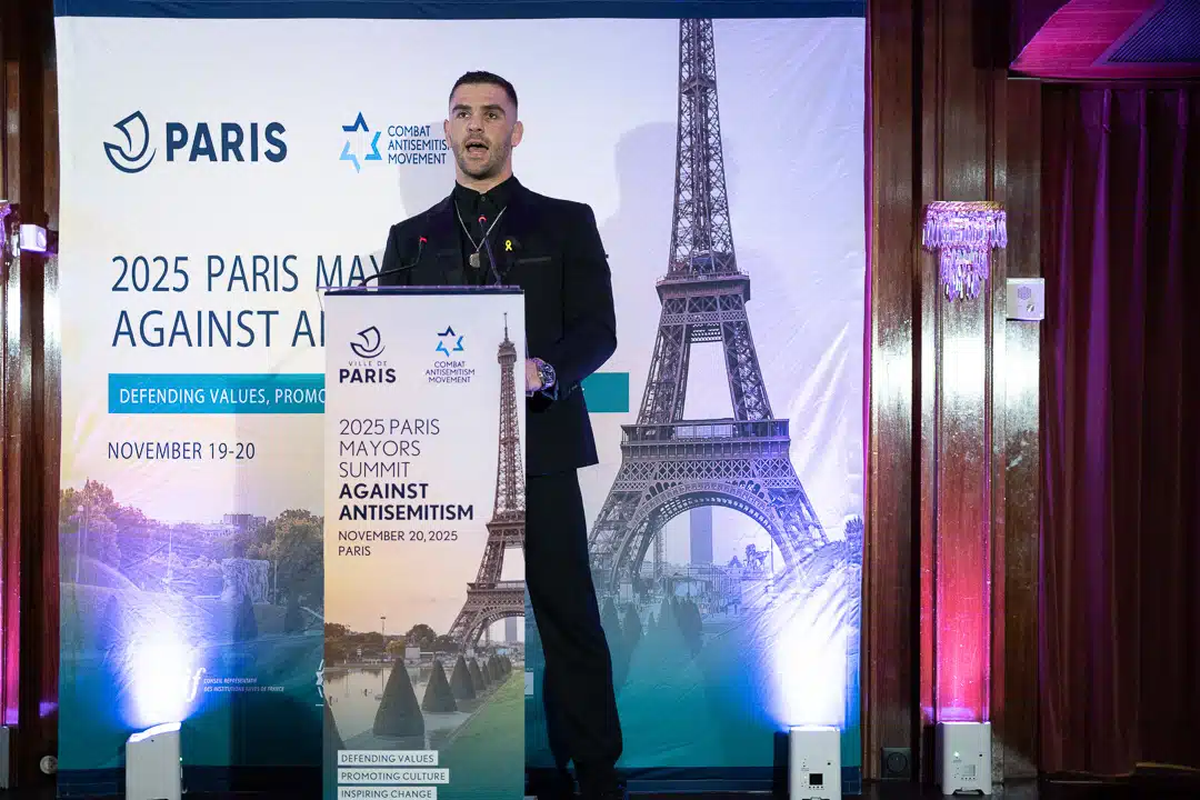 Israeli Olympic judoka Peter Palchik speaks at the podium during the 2025 Paris Mayors Summit Against Antisemitism, organized by the Combat Antisemitism Movement
