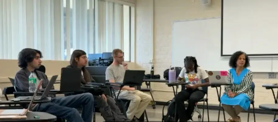 Professor Melina Abdullah (R, with blue dress) speaking to students during a classroom session at California State University, Los Angeles.