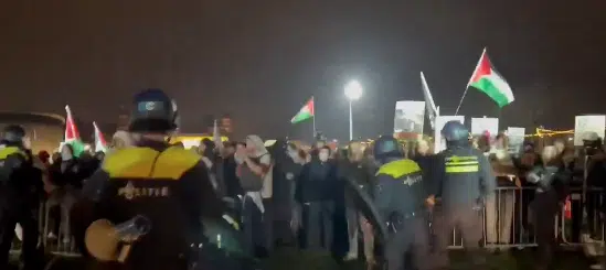 Police form a barrier between pro-Palestinian protesters and Jewish Hanukkah concert venue near Amsterdam’s Concertgebouw