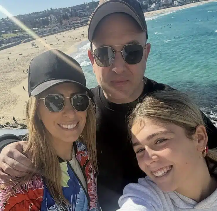Dionne Taylor stands with her husband and daughter overlooking Bondi Beach in Sydney, where a Hanukkah gathering was later targeted in a deadly antisemitic attack.