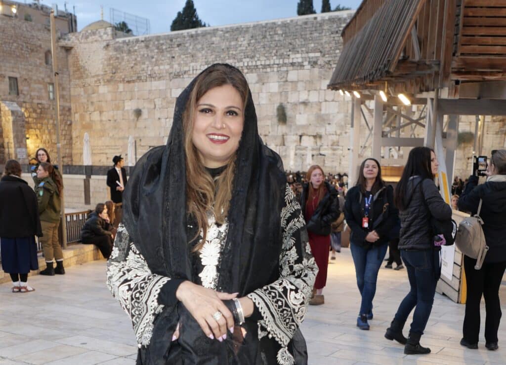 Anila Ali, President and Founder of the American Muslim and Multifaith Women’s Empowerment Council, stands in front of the Western Wall in Jerusalem during a CAM-led delegation to Israel.
