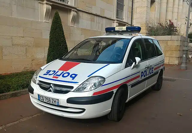 French police vehicle parked outside a public building in Paris amid an investigation into vandalism at a Jewish elementary school.