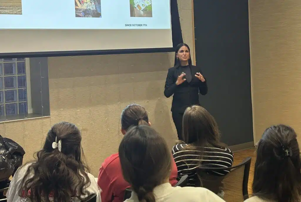 Natalie Sanandaji, a survivor of the October 7 Nova Music Festival massacre, speaks to students during an event at UW–Madison Hillel.