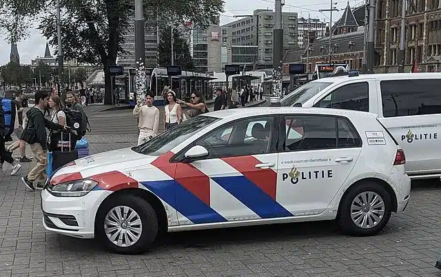 Dutch police vehicles parked near Amsterdam Central Station in Amsterdam, Netherlands.