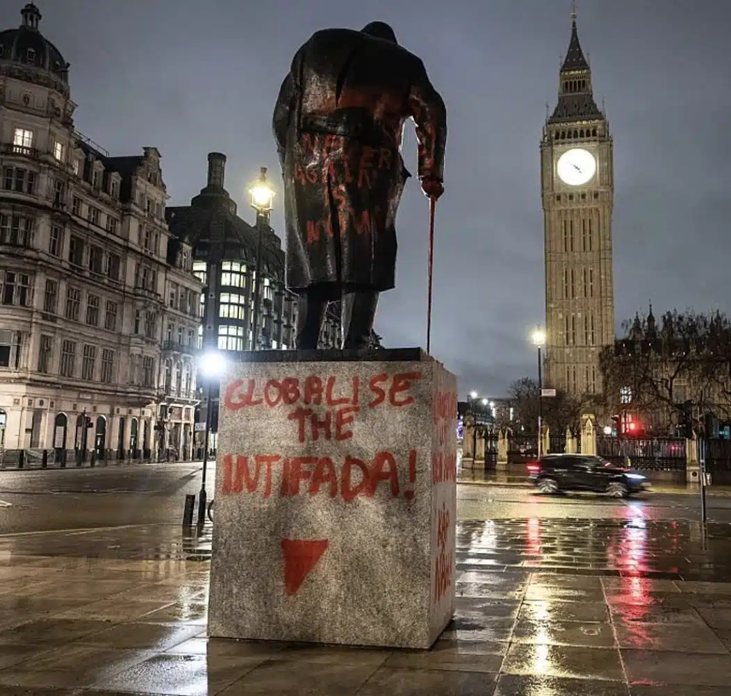 Statue of Winston Churchill in central London defaced with red “Globalize the Intifada” graffiti and a Hamas-linked inverted triangle symbol,