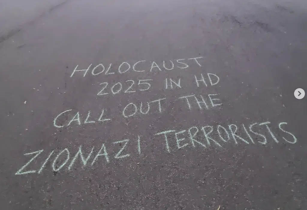 Chalk graffiti in Vancouver reading “Holocaust 2025 in HD. Call out the Zionazi terrorists” written on pavement