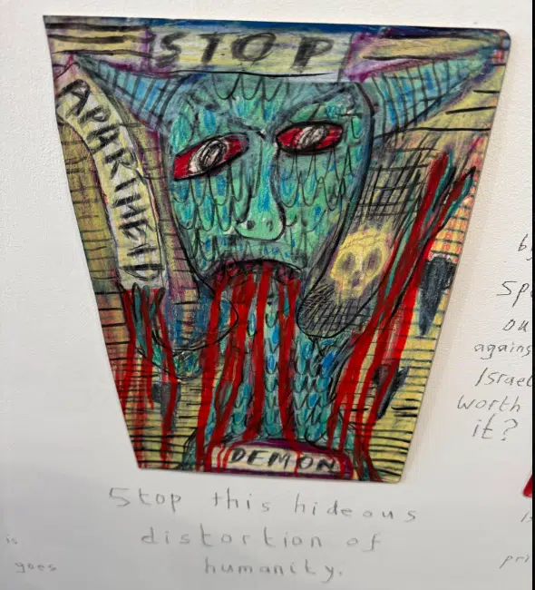 Disturbing artwork depicting a horned, demonic figure with blood imagery, reflecting antisemitic themes shown in a UK exhibition