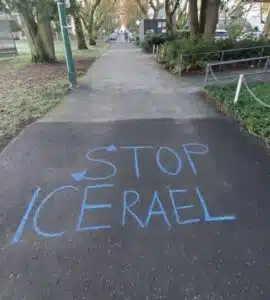 Chalk message reading “Stop ICErael” written on a pathway in Vancouver, merging Israel with U.S. immigration enforcement