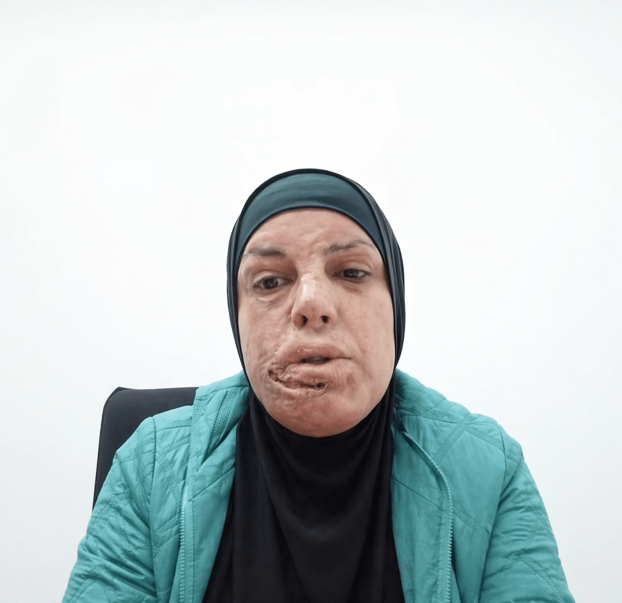 Israa Jaabis speaking via video during a UC Berkeley classroom event