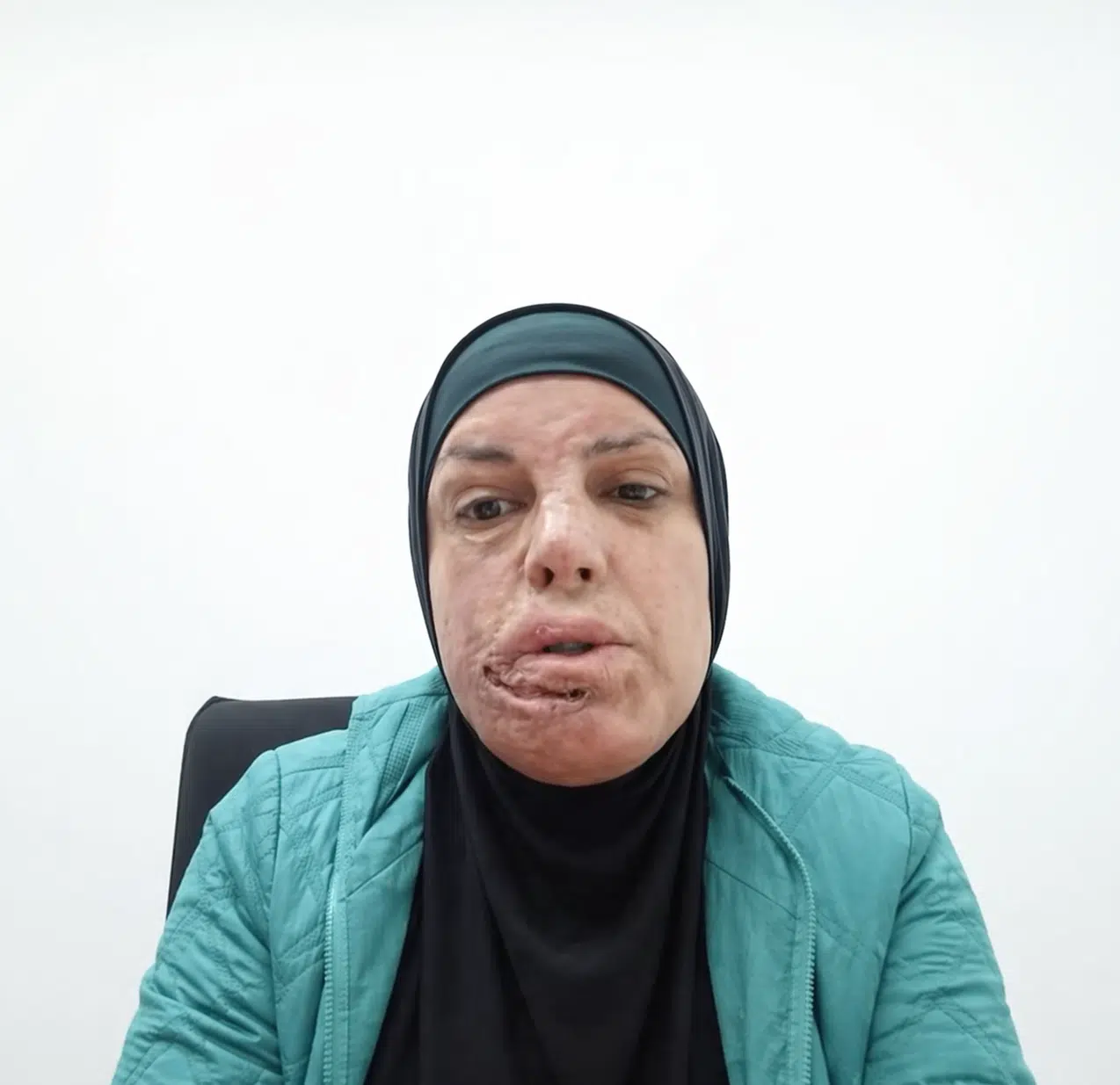 Israa Jaabis speaking via video during a UC Berkeley classroom event