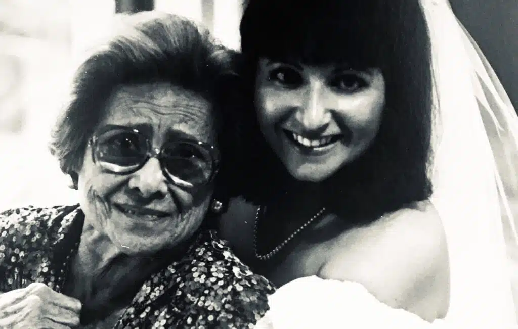 Black-and-white photo of Linda Margolin Royal on her wedding day standing beside her grandmother Felka, a Holocaust survivor who received a Sugihara visa.