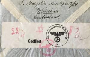 Censored envelope sent from the Warsaw Ghetto, marked with Nazi inspection stamps, addressed to family members who had escaped to Japan.