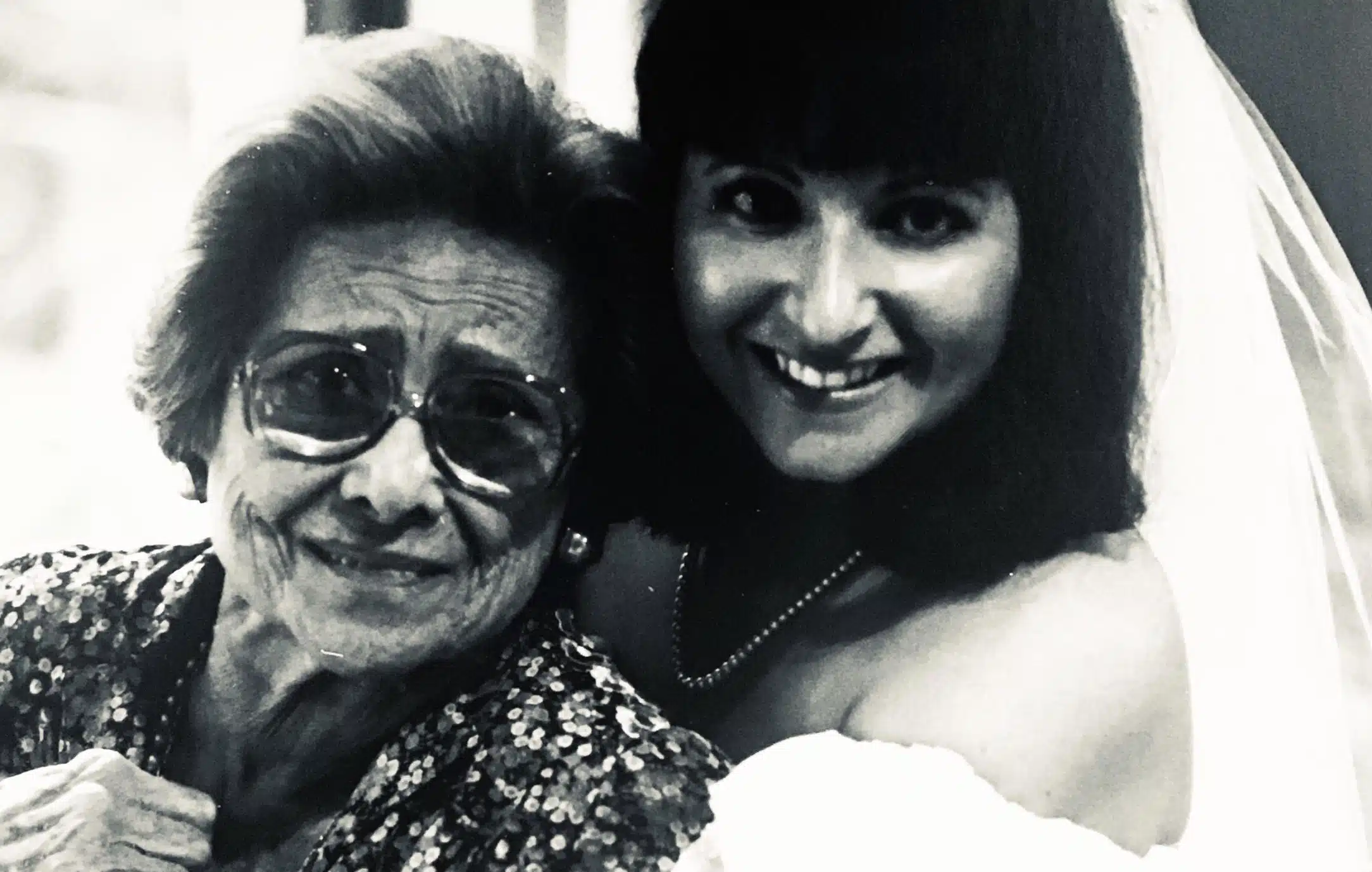 Black-and-white photo of Linda Margolin Royal on her wedding day standing beside her grandmother Felka, a Holocaust survivor who received a Sugihara visa.