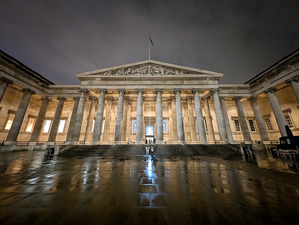 The British Museum in London illuminated at night.