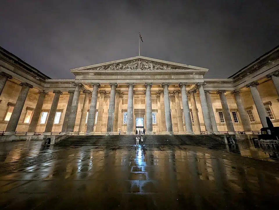 The British Museum in London illuminated at night.
