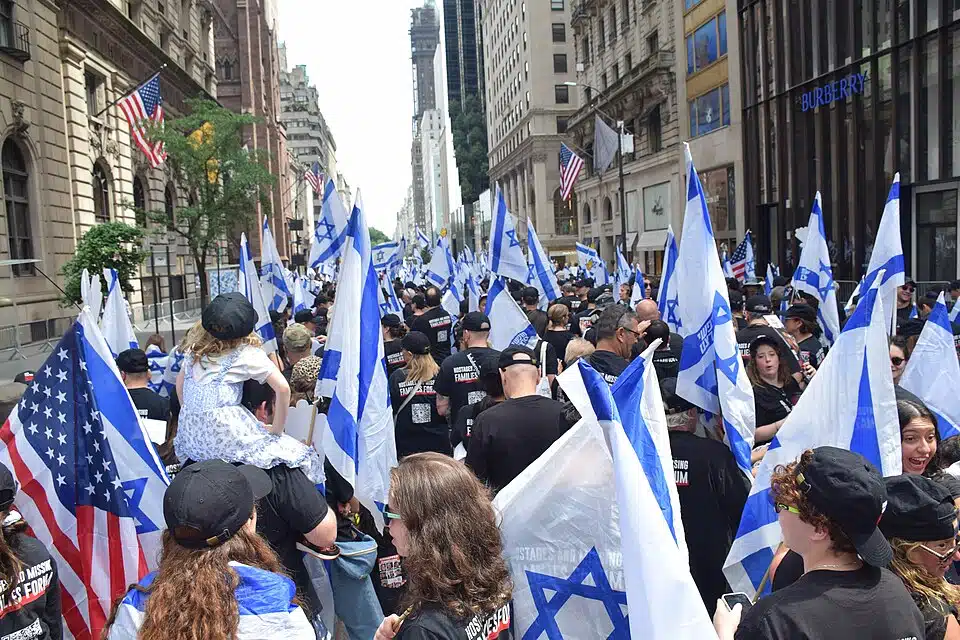 Participants carrying Israeli and American flags march along Fifth Avenue during the Celebrate Israel Parade in New York City