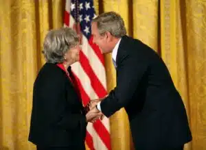 Author and scholar Ruth Wisse shakes hands with former U.S. President George W. Bush during a ceremony at the White House where she received the National Humanities Medal in November 2007.