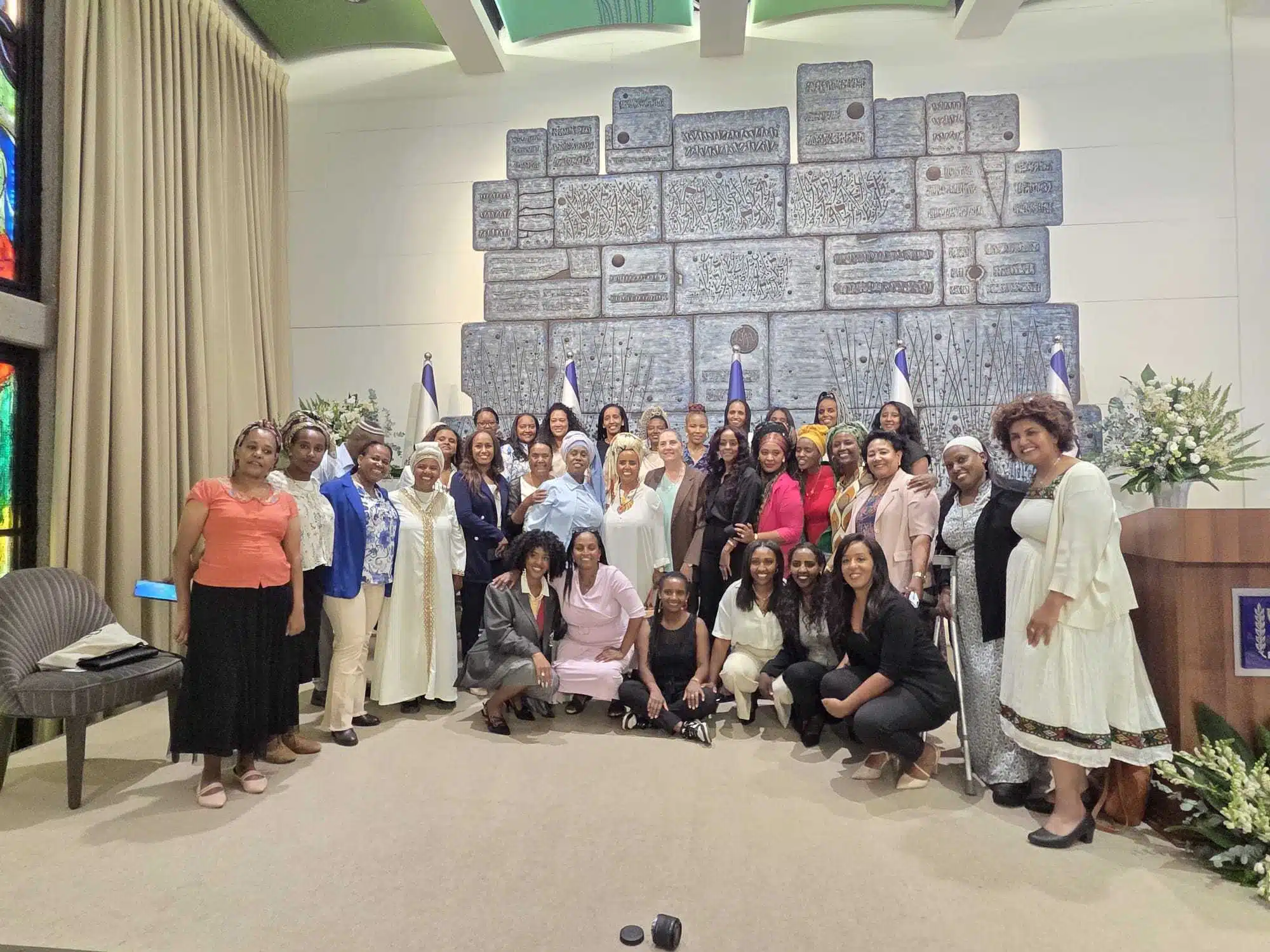 Participants in the Nashim VeShorashim ("Women and Roots") book launch pose for a group photo at the President's Residence in Jerusalem.