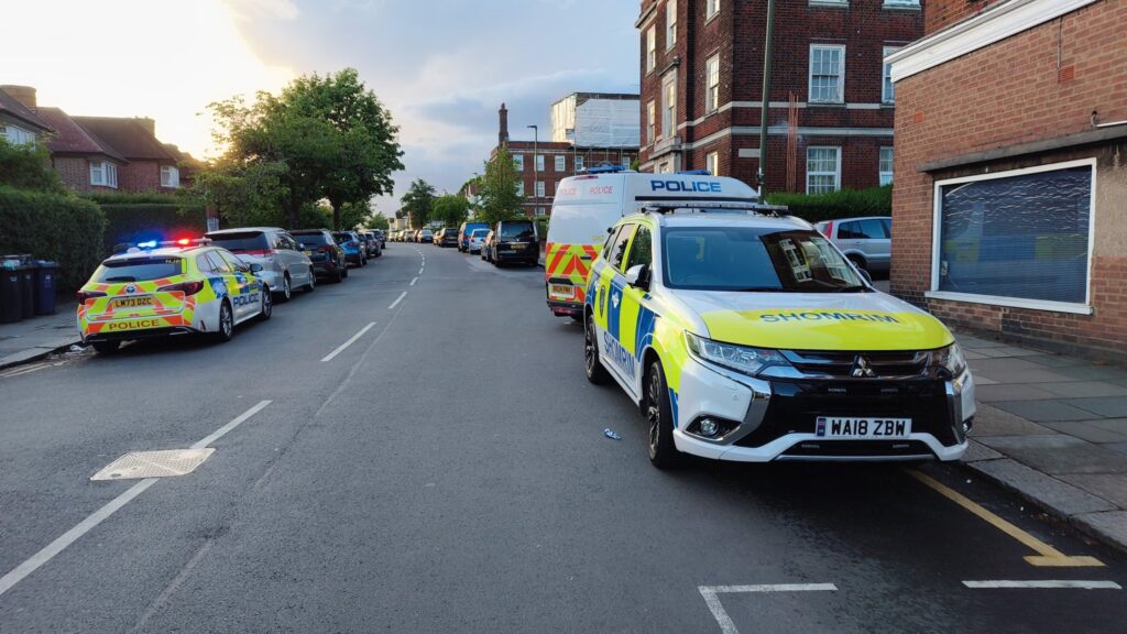 Shomrim and Metropolitan Police vehicles on Bridge Lane, Golders Green, following a suspected arson attack on a predominantly Jewish residential building.