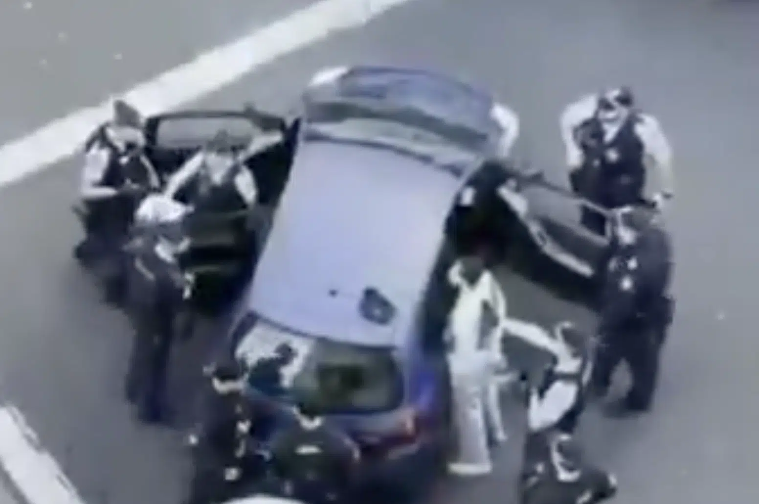 New South Wales Police officers detain two suspects following an alleged fake gun threat outside a Chabad synagogue in Sydney's Double Bay during Shabbat.
