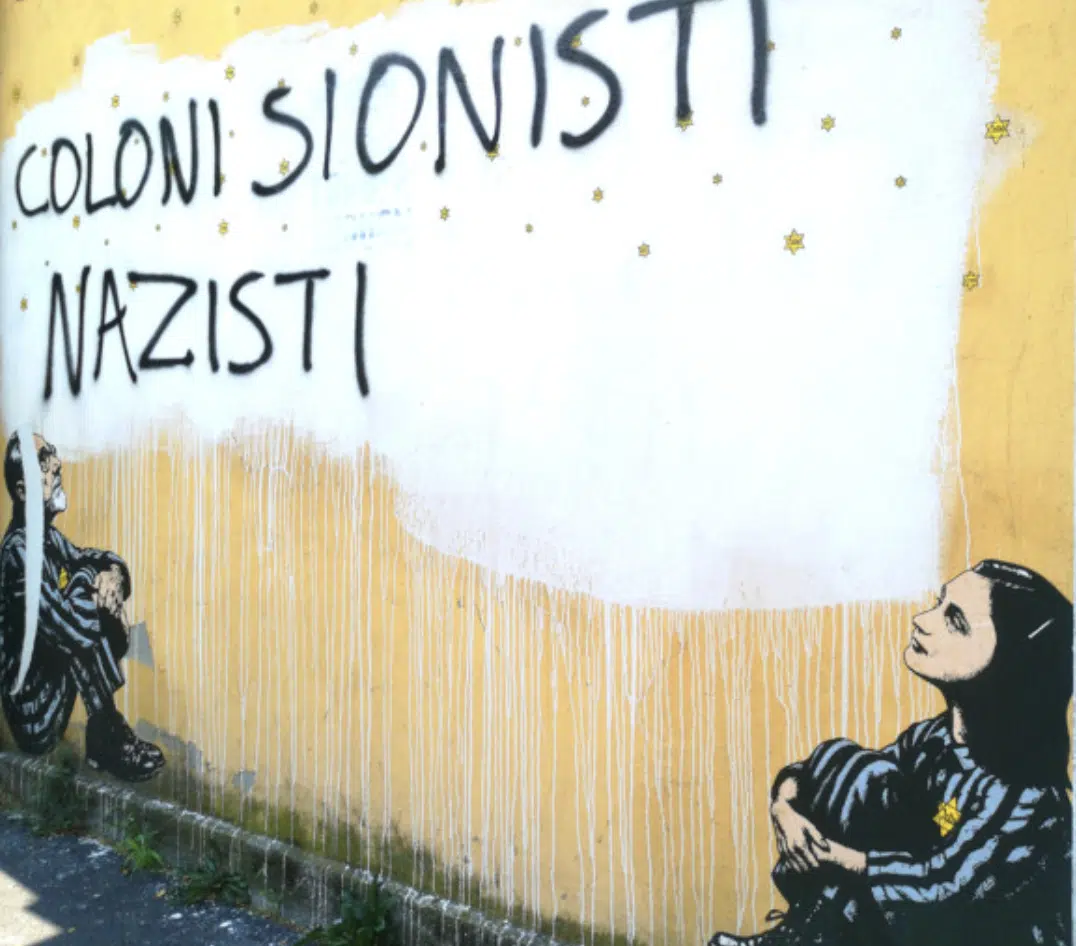 Antisemitic graffiti reading "Coloni Sionisti Nazisti" ("Zionist Settler Nazis") defaces a Milan mural depicting Anne Frank and Holocaust survivor Primo Levi.
