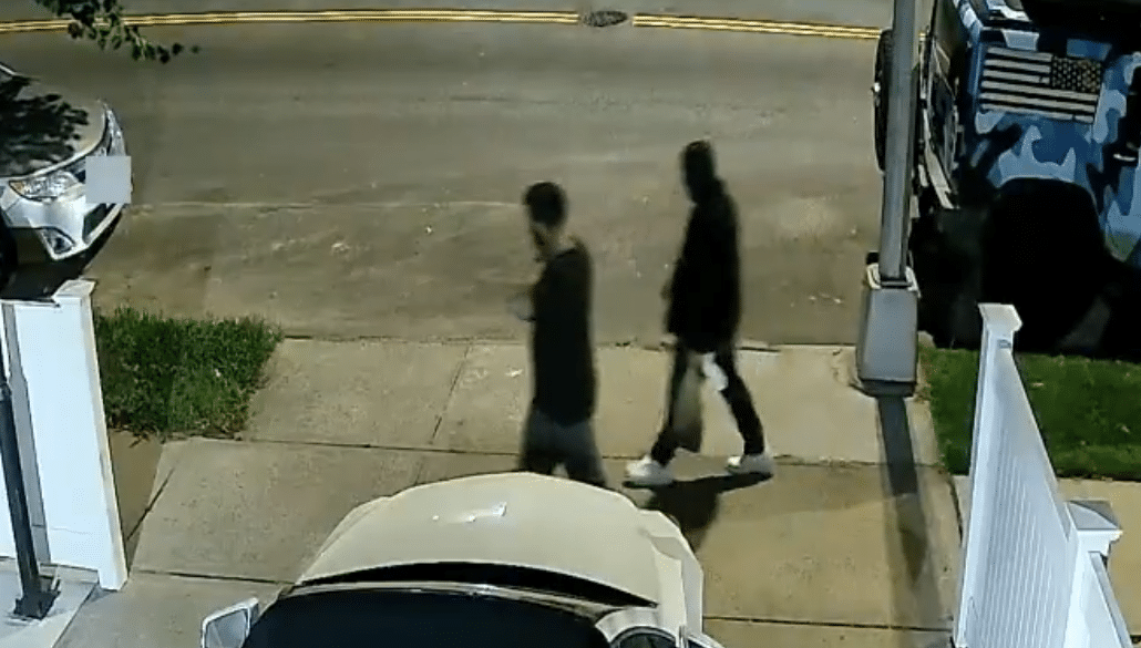 Surveillance footage shows two suspects sought by the NYPD in connection with the vandalism of two Queens synagogues.