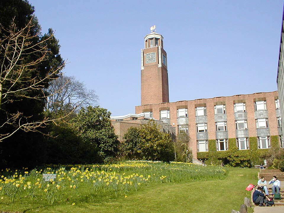 Clock tower and brick campus building at the University of Exeter