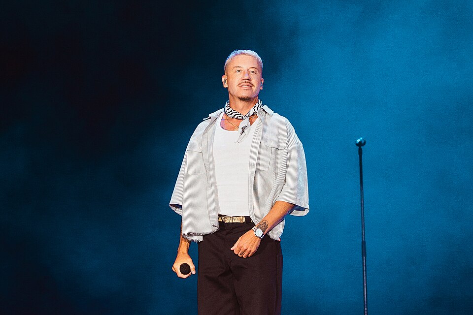 Rapper Macklemore performs onstage